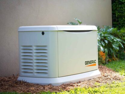 A Generac standby generator is installed next to a house|||
