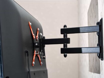 Back view of a wall-mounted flat-screen TV with an adjustable black and orange bracket.||