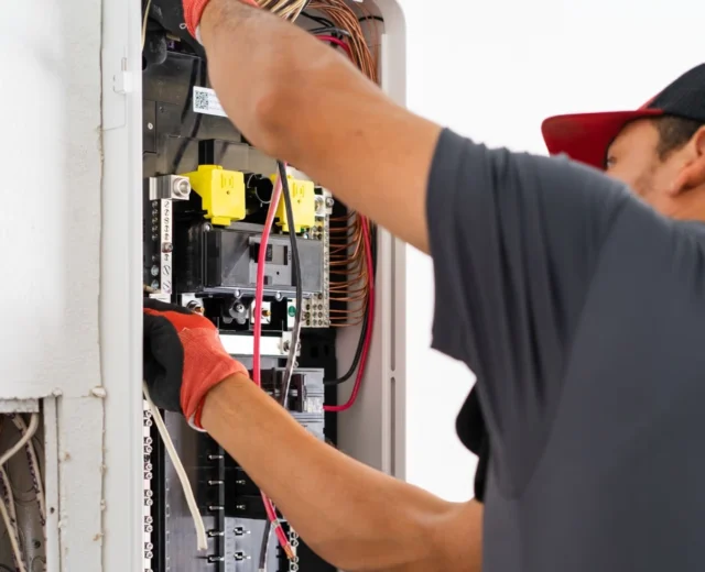 Electrician installing new SPAN electrical panel
