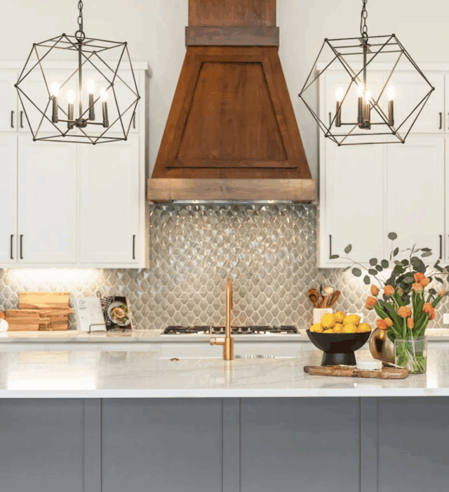 Kitchen lighting above the kitchen island in a new home by Group Three Builders